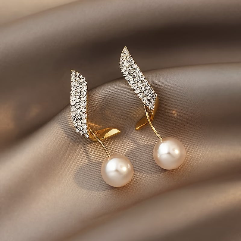 Pearl earrings with crystal spring