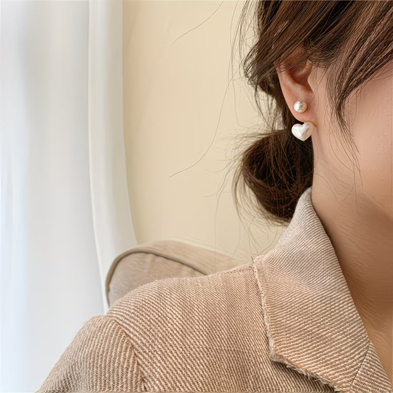 Heart-shaped earrings with double pearl