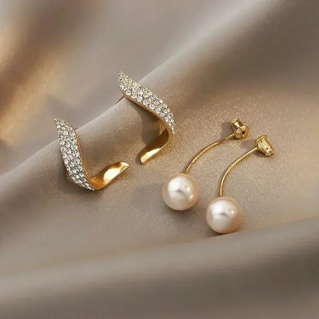Pearl earrings with crystal spring