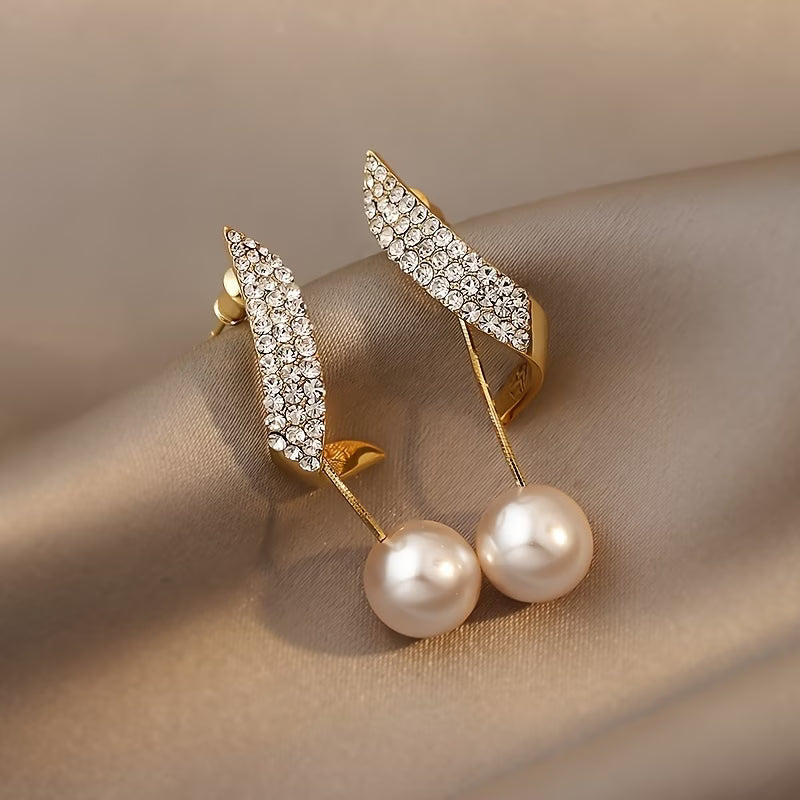 Pearl earrings with crystal spring