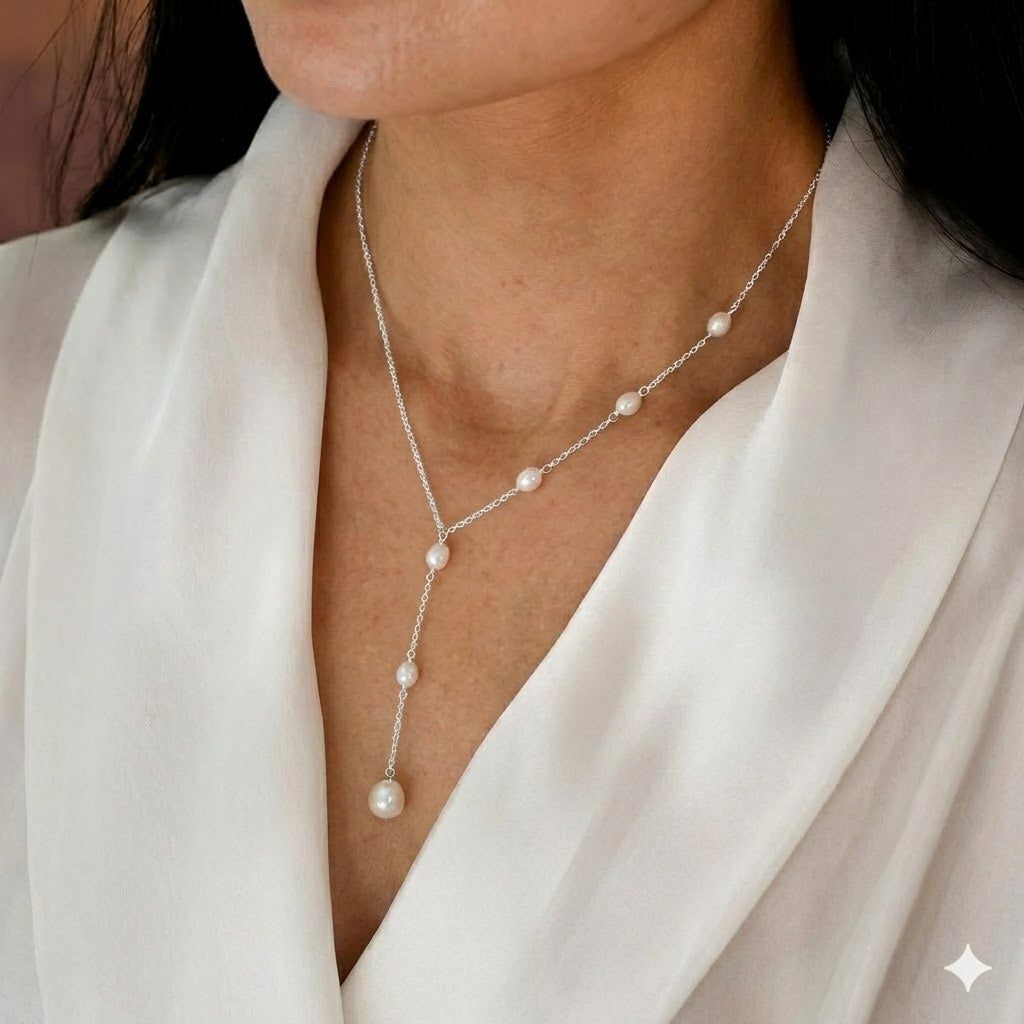 Lariat necklace with a cascade of pearls